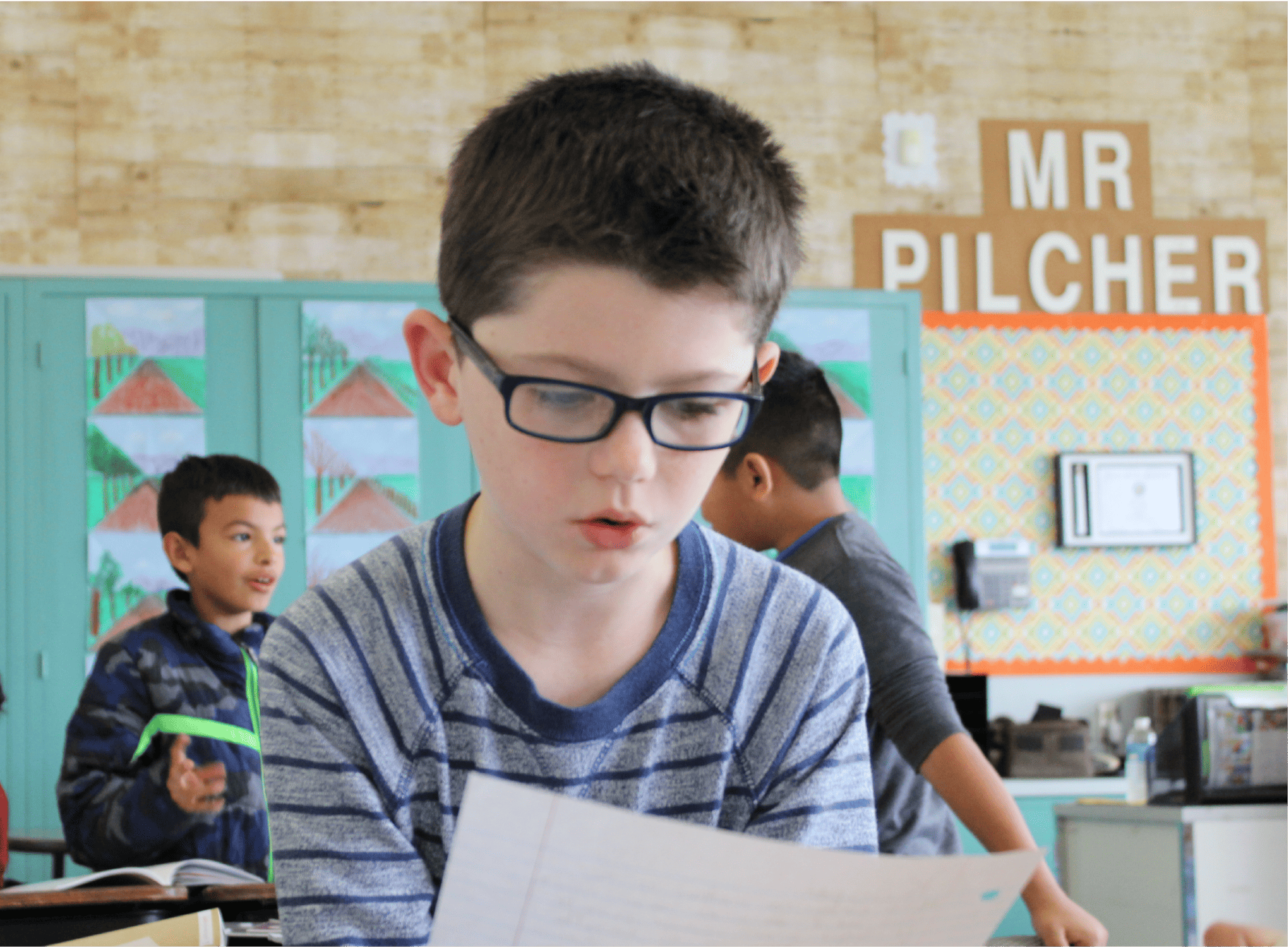 A student reading a piece of paper