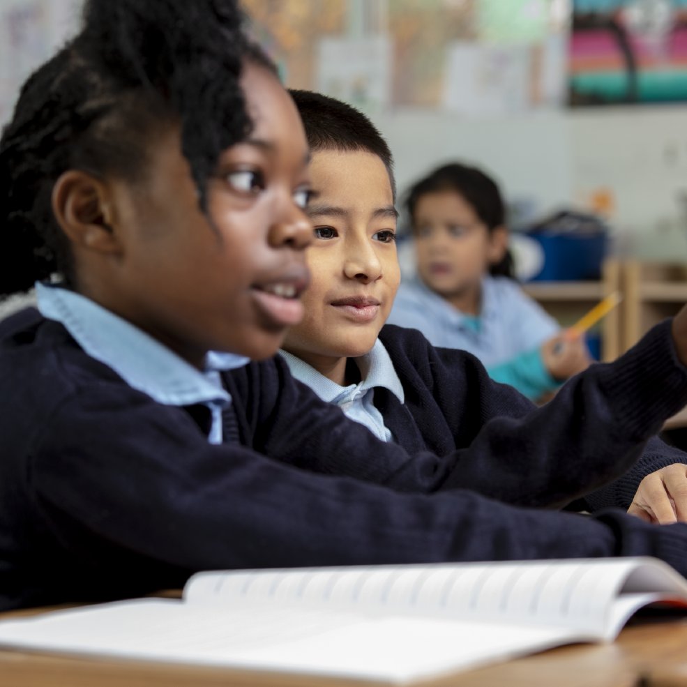 Two students with a notebook