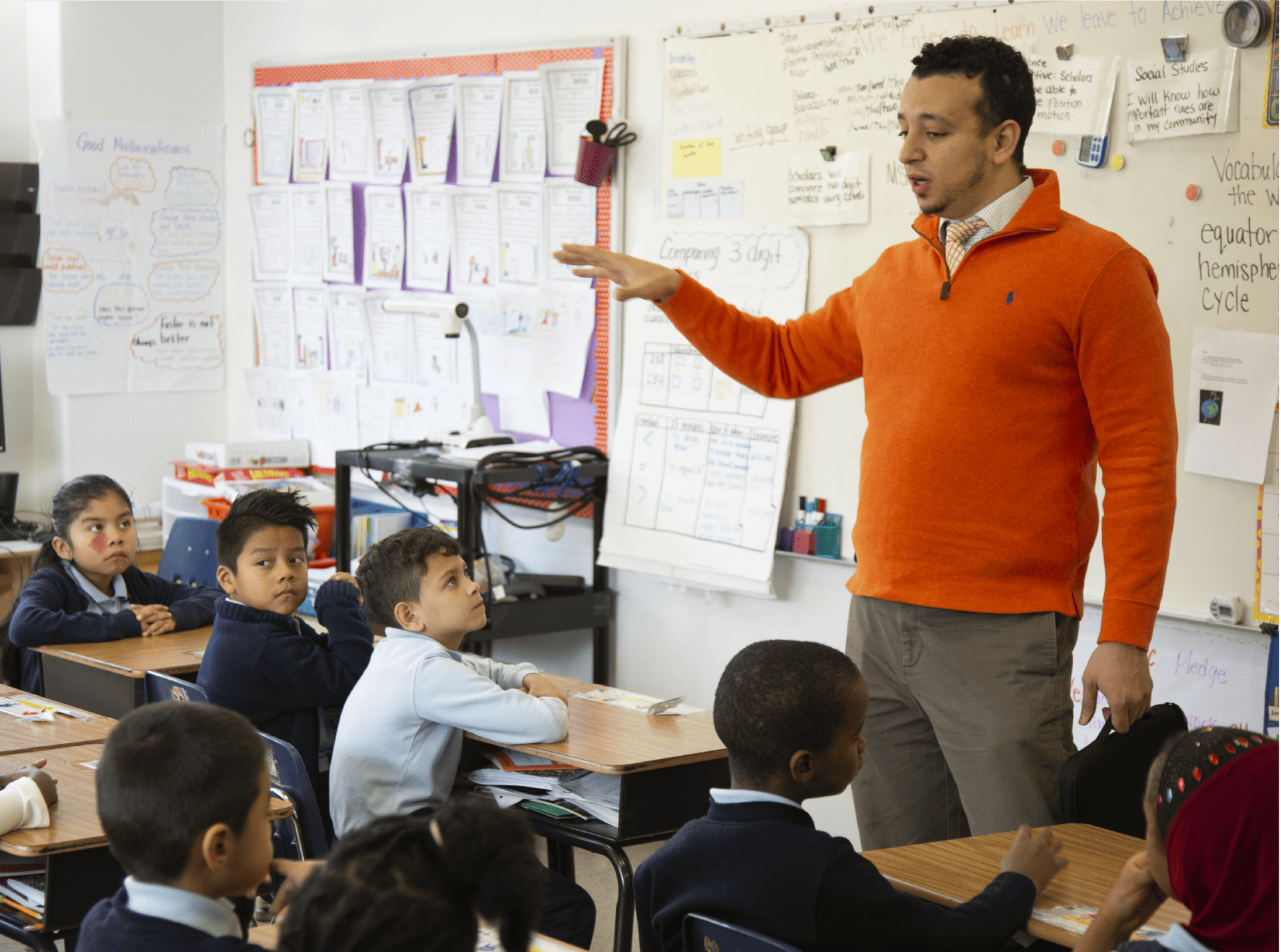 A teacher instructing a classroom of students