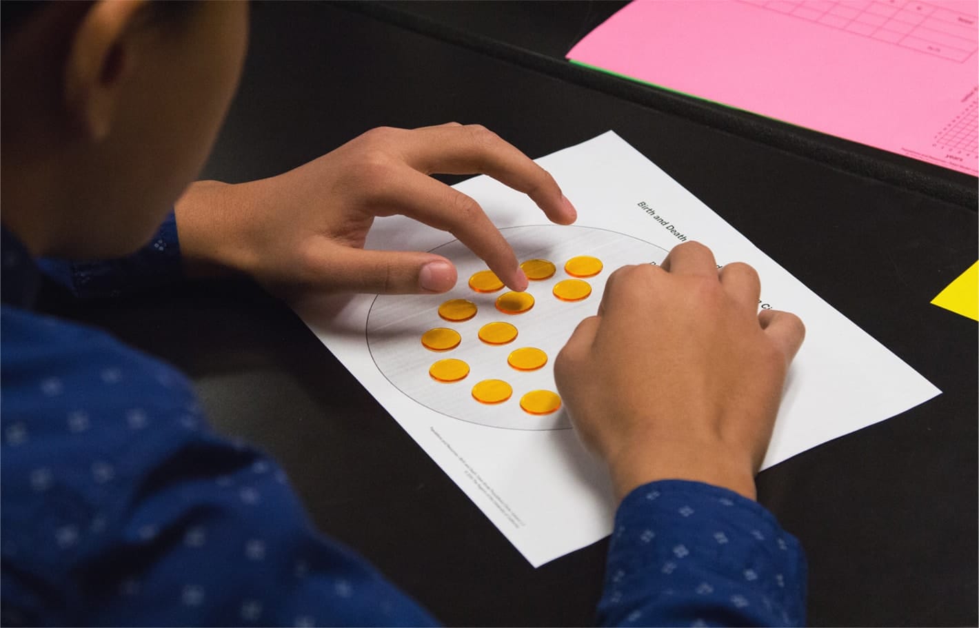 Student applying ngss learning with interactive worksheet