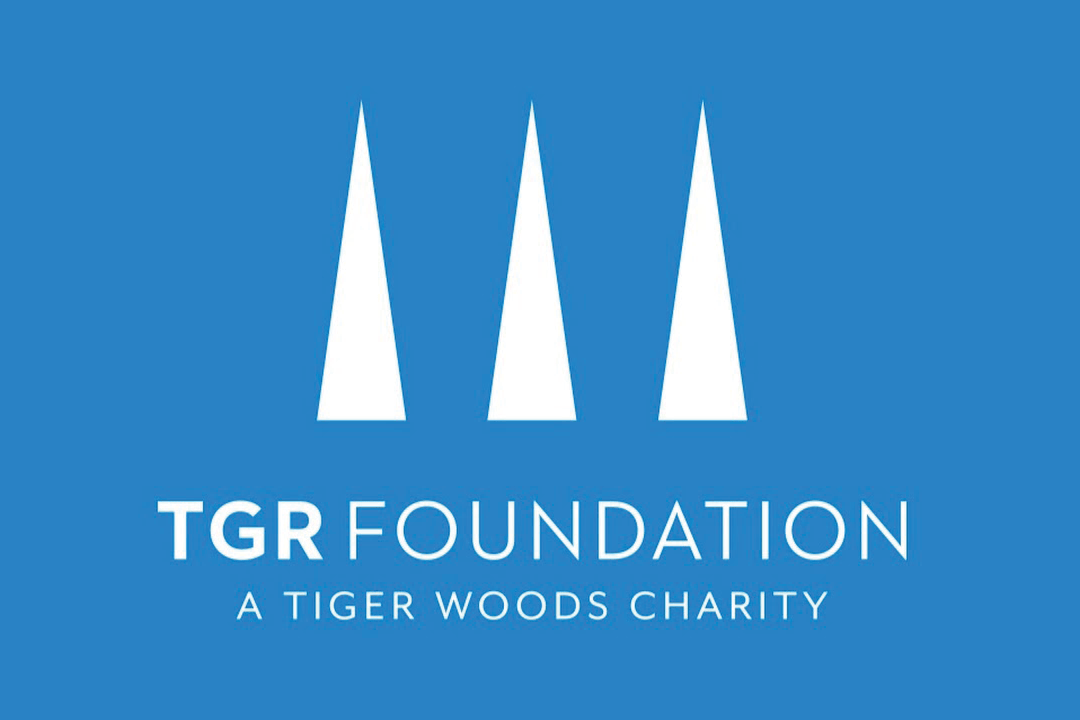 Logo of the TGR Foundation, a Tiger Woods charity, designed to engage students, featuring three white stylized triangles on a blue background with the foundation's name below.