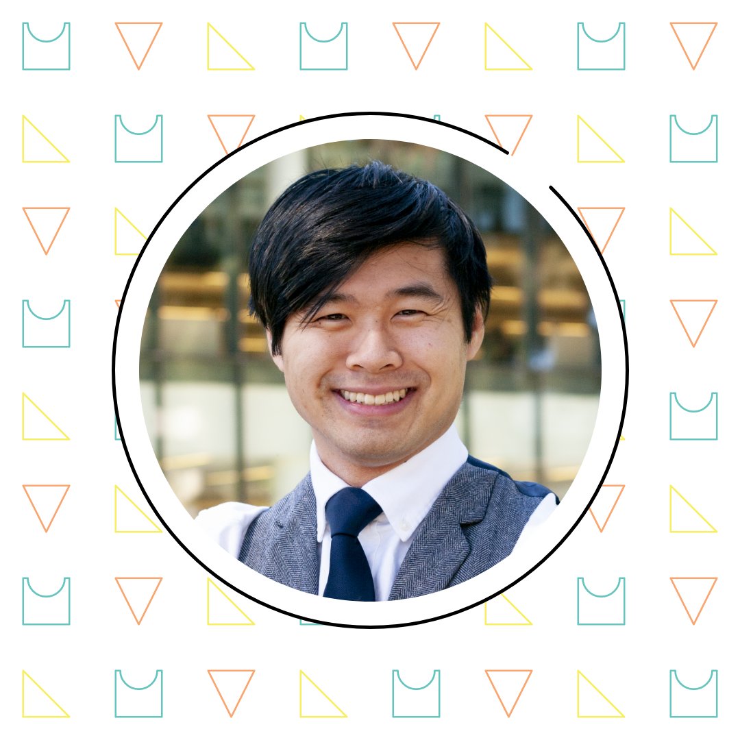 Smiling asian man in a suit and tie, framed in a white circle with a colorful geometric math pattern background.