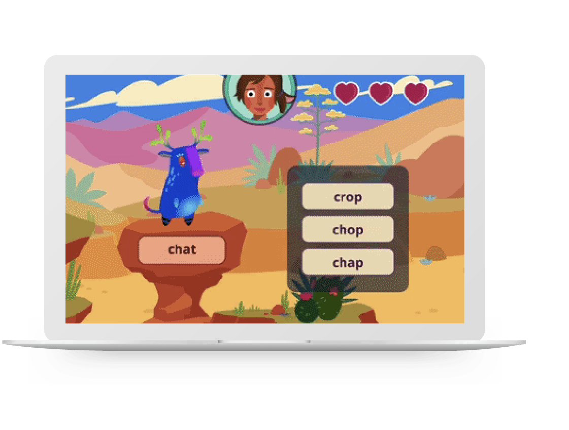 A laptop screen displaying a literacy intervention game with a cartoon llama in a desert setting and a word selection task presented to a child’s avatar in the corner.