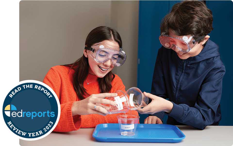 A woman and a boy wearing safety goggles doing a science experiment with liquids in an Amplify education laboratory setting. Text overlay: 