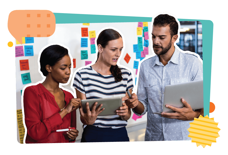 Three people collaborate using digital tablets in front of a whiteboard covered with colorful sticky notes, seamlessly integrating aspects of the Catholic school curriculum into their innovative planning session.